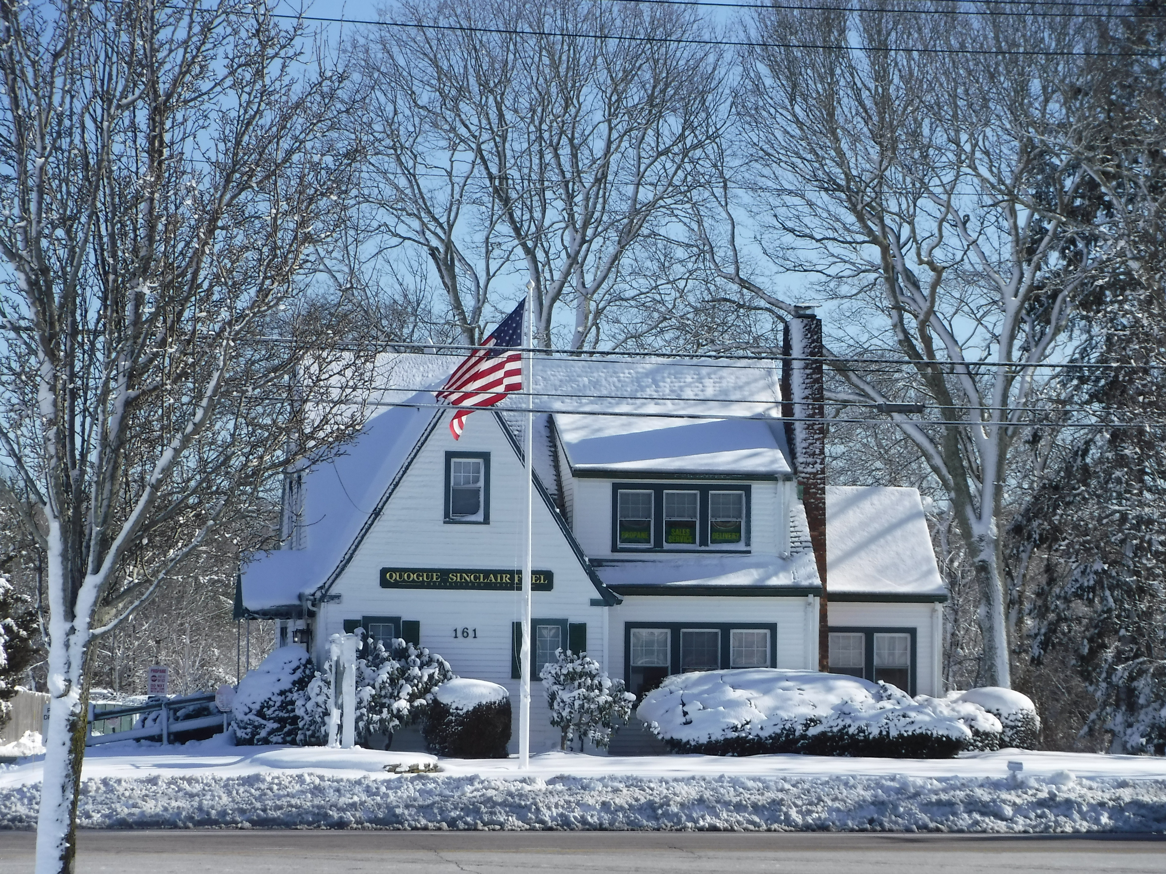 Photograph of the Quogue Sinclair office in winter, covered with snow, by Brenda Sinclair